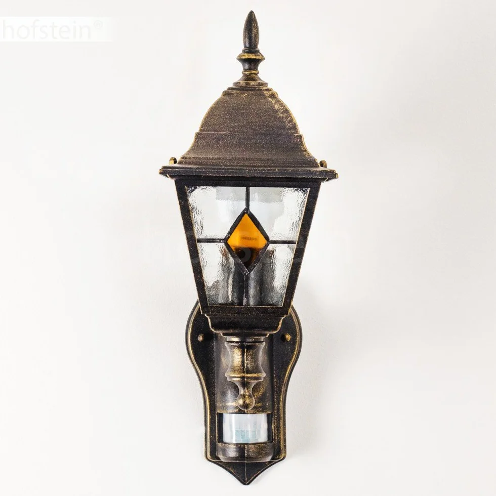 Zewnętrzna lampa ścienna Antibes z czujnikiem ruchu, z odlewu aluminiowego w kolorze brązowym/złotym z przezroczystymi szybami,/podwórko z oprawką E27 w kolorze antycznym, bez żarówek